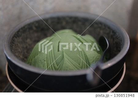 fragrant wasabi powder on a black wooden background. fragrant wasabi powder on a black wooden background. 130851948