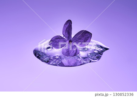A textured drop of serum with lilac. 130852336
