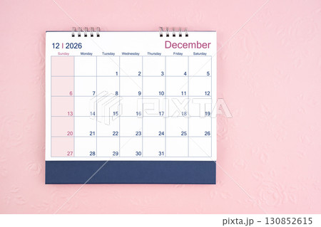 Directly above view of December 2026 desk calendar on pink background with copy space. 130852615