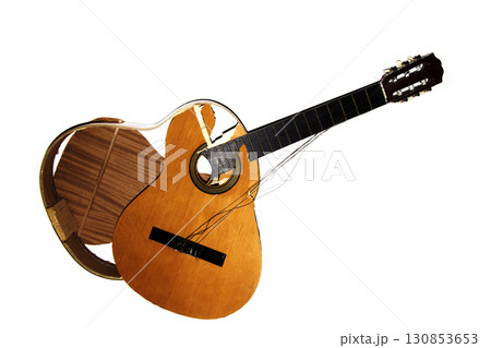 A broken smashed acousitic guitar music instrument on white background 130853653