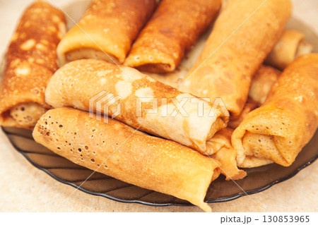 Cooking homemade Russian pancakes Bliny with meat on Shrovetide - Maslenitsa 130853965