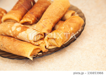 Cooking homemade Russian pancakes Bliny with meat on Shrovetide - Maslenitsa 130853966