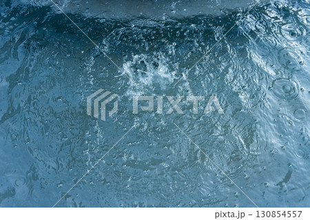 Circles on the water from falling drops of water. Circles on the water from falling drops of water. 130854557