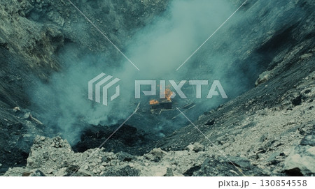 Burning Debris in Smoky Dark Pit Dramatic Scene Industrial Disaster Fire Coal Mine Grey Blue View Burning Debris in Smoky Dark Pit Dramatic Scene Industrial Disaster Fire Coal Mine Grey Blue View 130854558