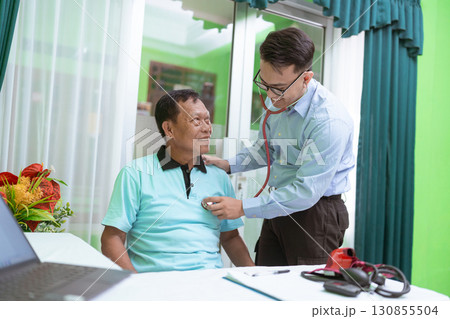 Patient Consultation The Doctor is Thoroughly Examining the Heartbeat in a Medical Office 130855504