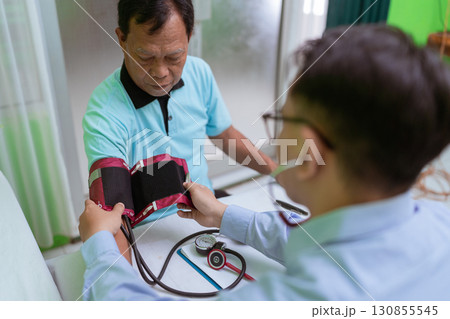 Health Check A Doctor is Measuring the Blood Pressure of a Patient Today Health Check A Doctor is Measuring the Blood Pressure of a Patient Today 130855545