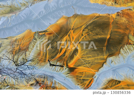 Patterns of acid mine drainage in decanting lake, nature pollution, aerial view Patterns of acid mine drainage in decanting lake, nature pollution, aerial view 130856336