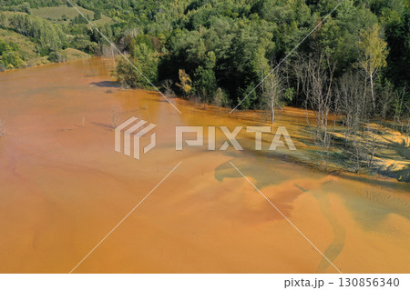 Patterns of acid mine drainage in decanting lake, nature pollution, aerial view Patterns of acid mine drainage in decanting lake, nature pollution, aerial view 130856340