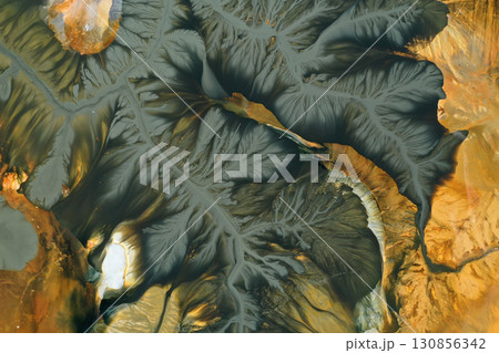 Patterns of acid mine drainage in decanting lake, nature pollution, aerial view Patterns of acid mine drainage in decanting lake, nature pollution, aerial view 130856342
