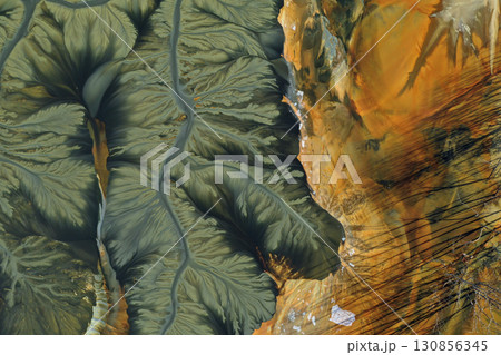 Patterns of acid mine drainage in decanting lake, nature pollution, aerial view Patterns of acid mine drainage in decanting lake, nature pollution, aerial view 130856345