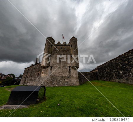 Enniskillen Castle is standing on the banks of Lough Erne in Northern Ireland. Dramatic clouds Enniskillen Castle is standing on the banks of Lough Erne in Northern Ireland. Dramatic clouds 130856474