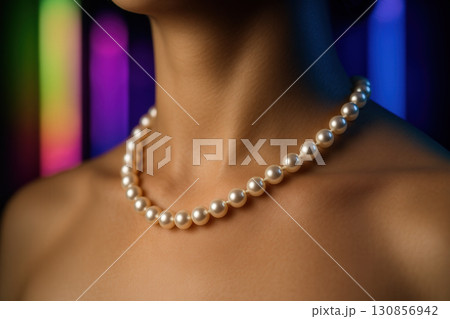 Classic Pearl Necklace on Collarbone with Luminous Night Colors 130856942
