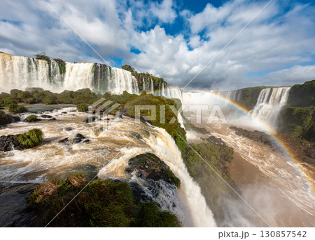Powerful Iguazu Falls, one of the world's most impressive waterfalls. Brazil side. Brazilian wilderness landscape. 130857542