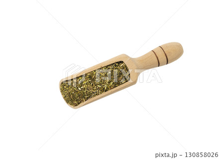 passion flower herb in latin - passiflora incarnata in wooden scoop isolated on white background. Medicinal herb. 130858026