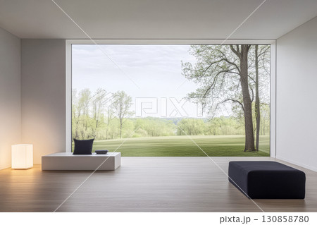 Modern interior with large window overlooking green landscape on a calm day 130858780