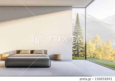 Modern bedroom with expansive windows showcasing mountain views and natural light in a serene setting 130858841