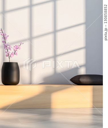 Elegant interior with black vase and cherry blossom arrangement reflecting soft light on minimalist surface Elegant interior with black vase and cherry blossom arrangement reflecting soft light on minimalist surface 130858852