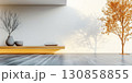 Modern interior design featuring minimalist furniture and a tree shadow in a bright space 130858855