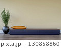 Modern living space with minimalist furniture and decorative plant in warm tones 130858860