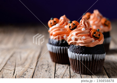 Halloween cupcakes with pumpkin decoration Halloween cupcakes with pumpkin decoration 130858878
