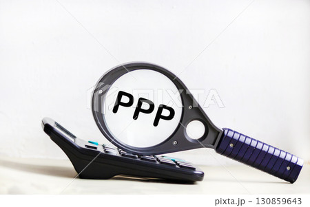PPP is a word on a magnifying glass and on the background of a light board with beautiful streaks.  130859643