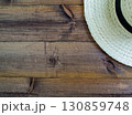 Summer vacation, flatlay. Hat on a dark wooden background. 130859748