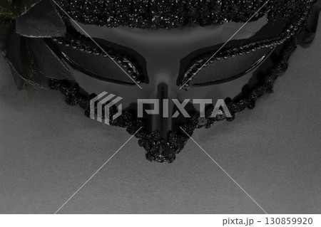 Black carnival mask on black background 130859920