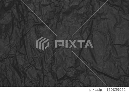 Black crumpled paper background 130859922