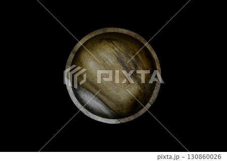 Brown bowl made from palm tree wood and isolated on black background Brown bowl made from palm tree wood and isolated on black background 130860026
