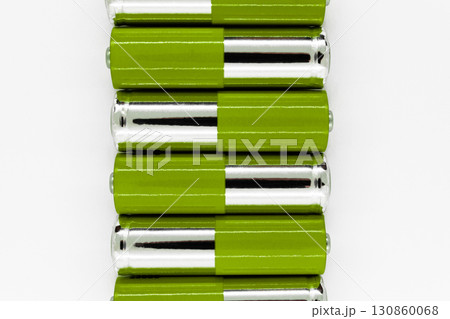 Composition of green and silver batteries placed in line and symbolize green energy, environment protection Composition of green and silver batteries placed in line and symbolize green energy, environment protection 130860068