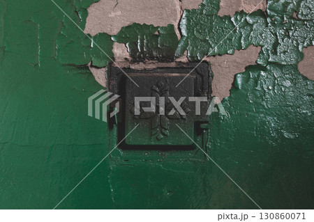 Concrete stove with closed metal doors 130860071