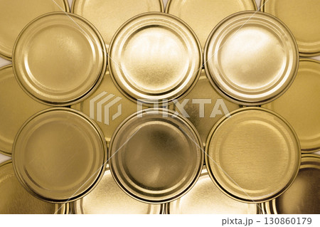 Golden jar lids background 130860179