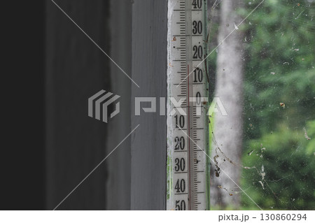 Old air thermometer hangs outside the window Old air thermometer hangs outside the window 130860294