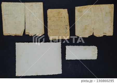 Old and Aged Document and Photo on Black Background Surface Old and Aged Document and Photo on Black Background Surface 130860295