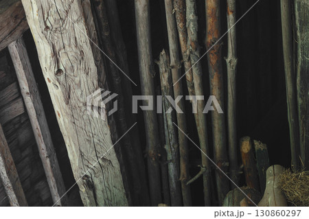 Old and dry wood branches placed in the barn attic background surface Old and dry wood branches placed in the barn attic background surface 130860297