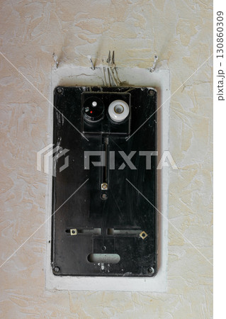 Old electrical fuses box hanging on the wall Old electrical fuses box hanging on the wall 130860309