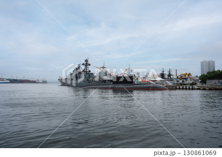 Vibrant port scene in Vladivostok showcasing naval vessels and nature Vibrant port scene in Vladivostok showcasing naval vessels and nature 130861069