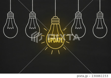 Hanging white outline lightbulbs on chalkboard background with one glowing yellow lightbulb featuring bold word update, symbolizing creative business announcement and innovation concept 130861153