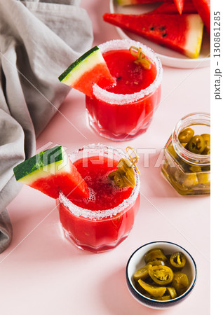 Watermelon jalapeno alcoholic margarita in glasses on table vertical view Watermelon jalapeno alcoholic margarita in glasses on table vertical view 130861285