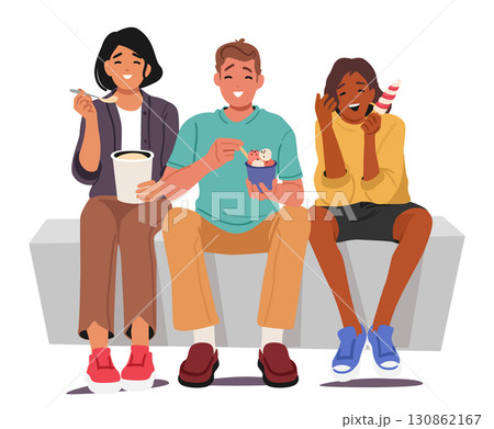 Happy teenage students smiling and laughing while eating ice-cream sweet treats of different flavor 130862167