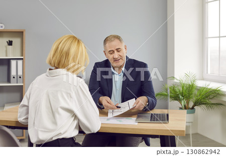 Real estate agent and customer meeting for house investment. 130862942