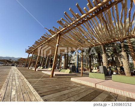 Well-equipped city beach on the Eilat embankment Well-equipped city beach on the Eilat embankment 130863152