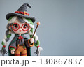 Cute little girl crochet doll with braids and a witch costume. 130867837