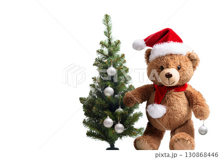 クリスマスツリーの飾りつけをするクマのぬいぐるみ 130868446