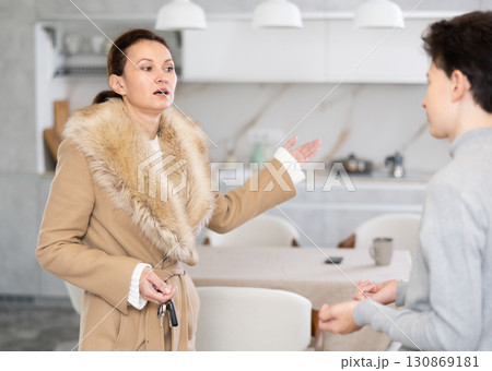 Single mother warns her teenage son about her late return from party Single mother warns her teenage son about her late return from party 130869181