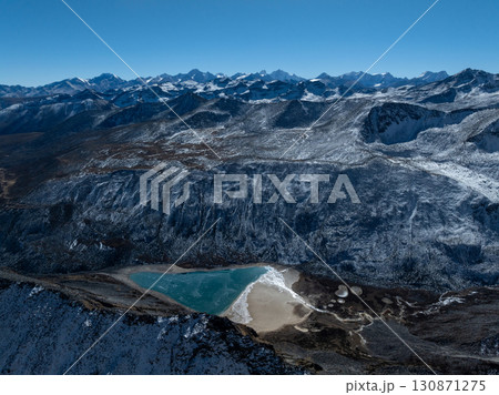 Aerial view of beautiful snow capped mountain and lake landscape in Tibet, China Aerial view of beautiful snow capped mountain and lake landscape in Tibet, China 130871275