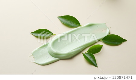 Green Cream Splash with Leaves symbolizing Natural and Organic Skincare 130871471