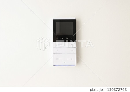 Modern remote control features simple design with various buttons Modern remote control features simple design with various buttons 130872768