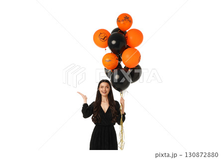 Woman holds colorful balloons in a Halloween theme, isolated on white, PNG Woman holds colorful balloons in a Halloween theme, isolated on white, PNG 130872880