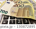 Calculator and Euro Bills. A professional stock photo of 200 euro banknotes on a calculator. Calculator and Euro Bills. A professional stock photo of 200 euro banknotes on a calculator. 130872895